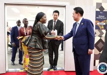 Minister of Foreign Affairs and Dean of the Cabinet, Hon. Sara Beysolow Nyanti, and His Excellency Yool Suk Yeol, President of the Republic of South Korea, shake hands before a meeting in Seoul on the sidelines of the Korea-Africa Summit 2024.