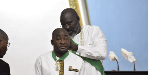H. E. President Weah decorating Foreign Minister Kemayah at Liberia’s 176th Independence Anniversary Celebration   